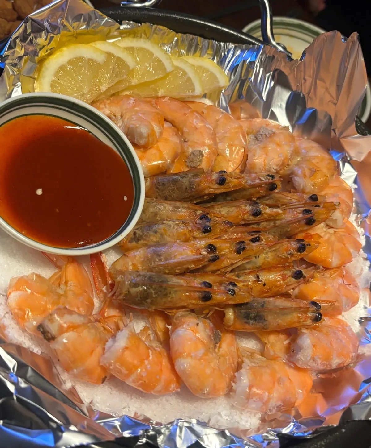 Table setting with the seasonal grilled tiger prawns, limited to 10 a day