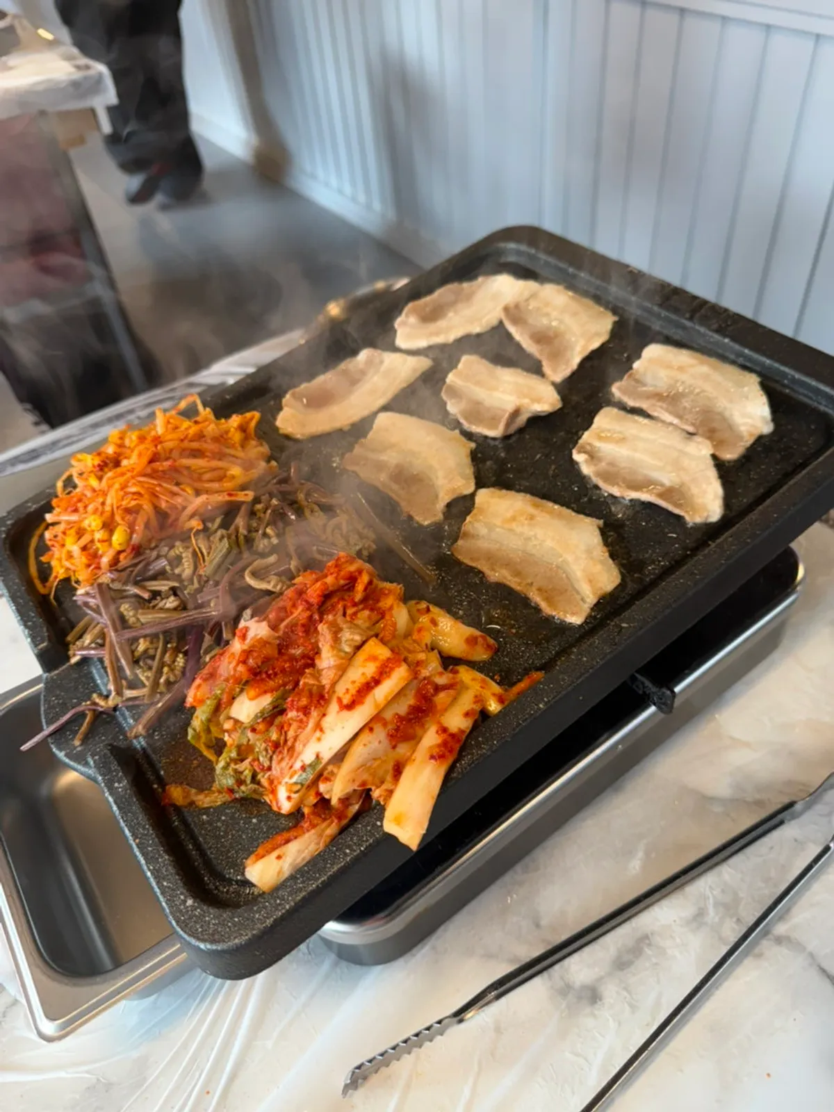 Fresh and frozen pork belly plated and ready to grill
