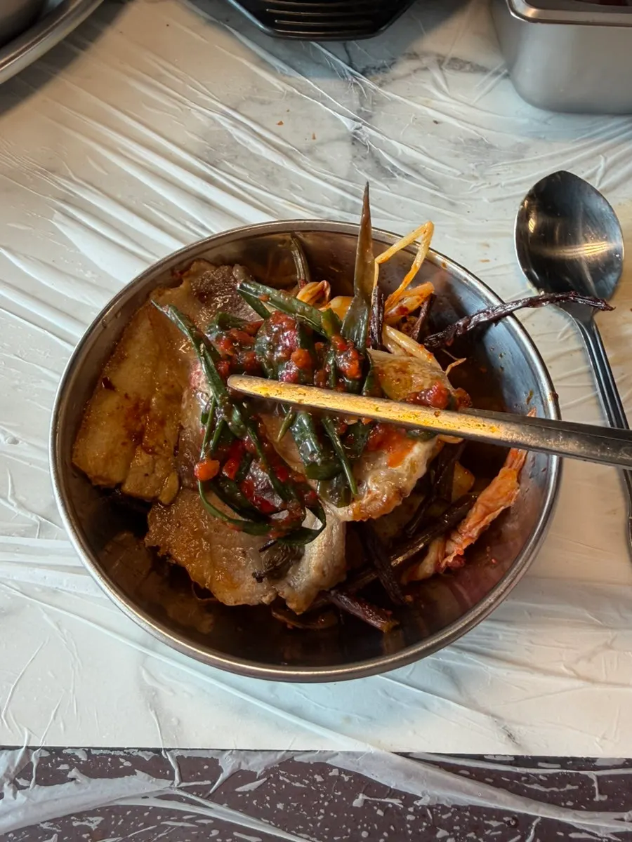 Fully cooked fresh pork belly with grilled side dishes