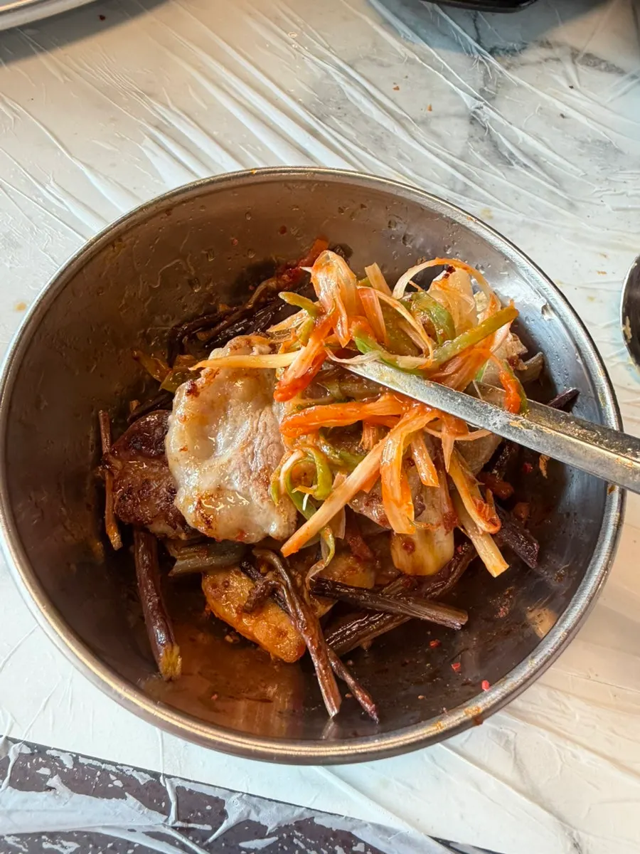 Fresh pork belly and grilled kimchi on the grill