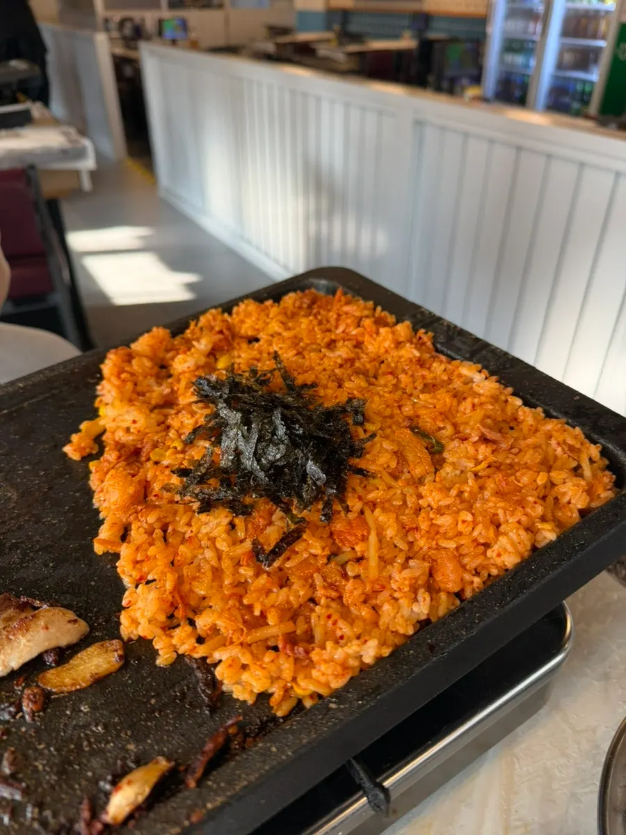 Kimchi fried rice spread thin and crisped on the grill