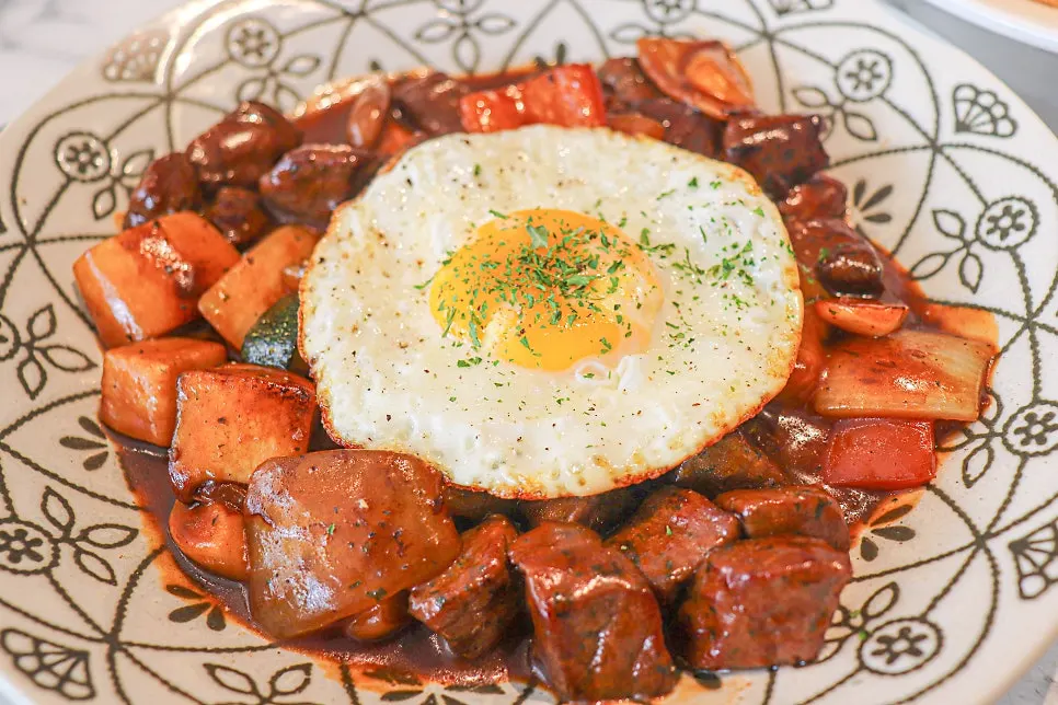 Chop steak topped with a fried egg