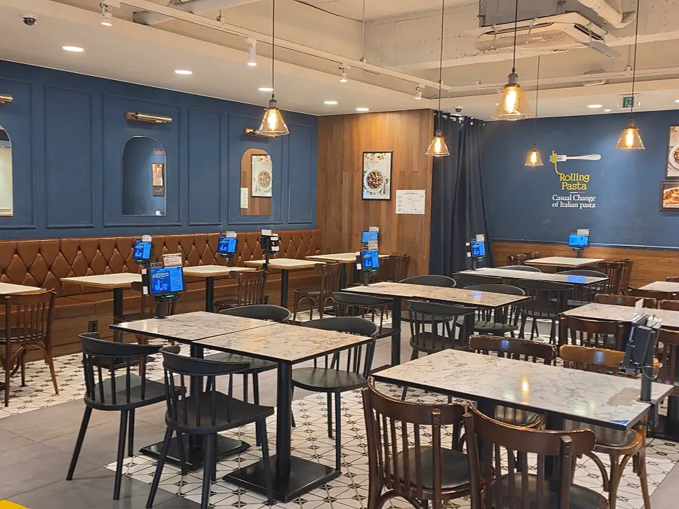 Entrance of the building housing Rolling Pasta Suwon Station Branch near Suwon Station
