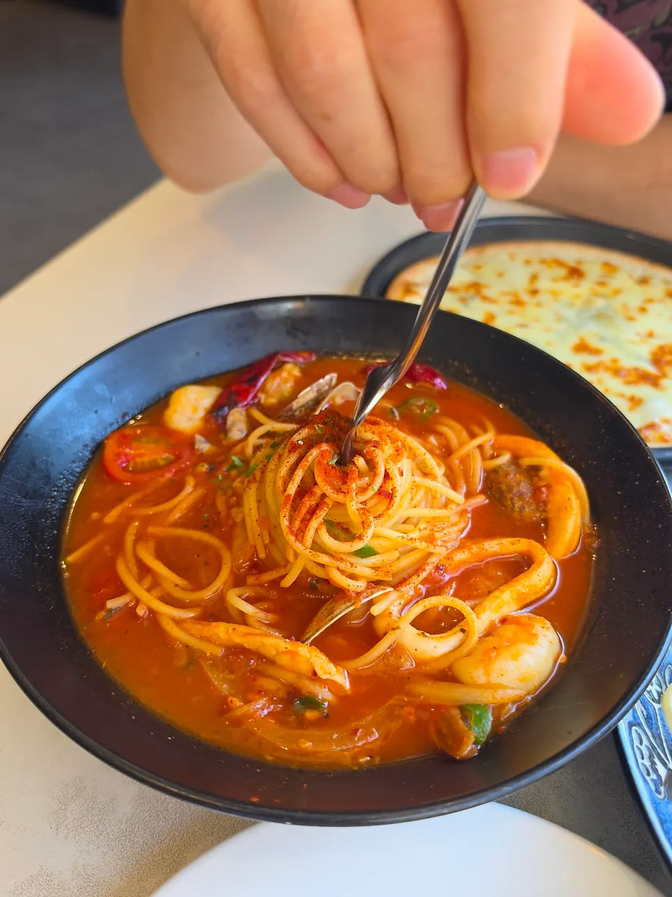 Close-up of the pache pasta with plenty of broth