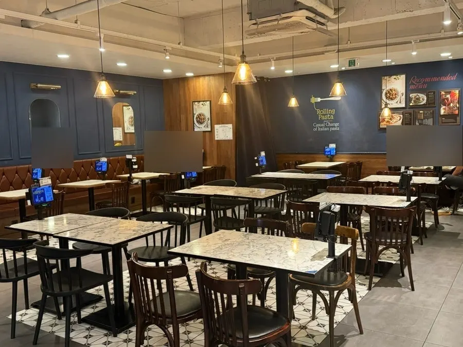 Interior of Rolling Pasta Suwon Station Branch with many tables