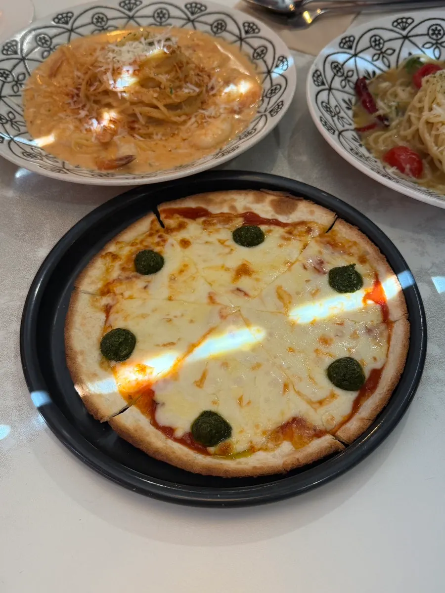 Small margherita pizza covered in cheese