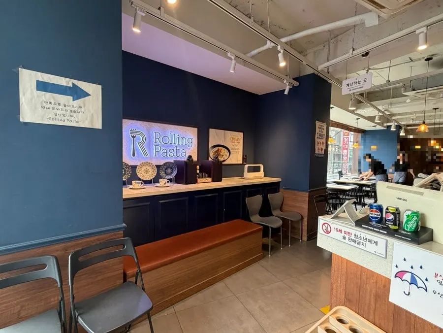 Wide dining hall tables at Rolling Pasta Suwon Station Branch