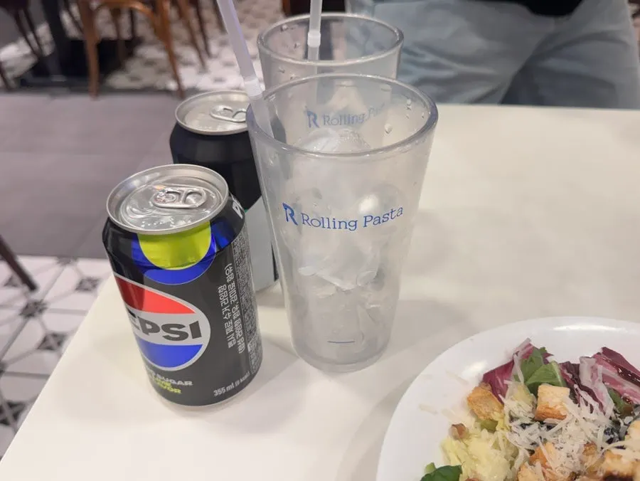 Water, pickles, and plates brought from the self-serve bar