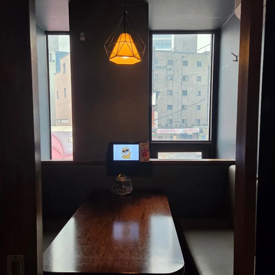 Table and lighting seen from inside the room