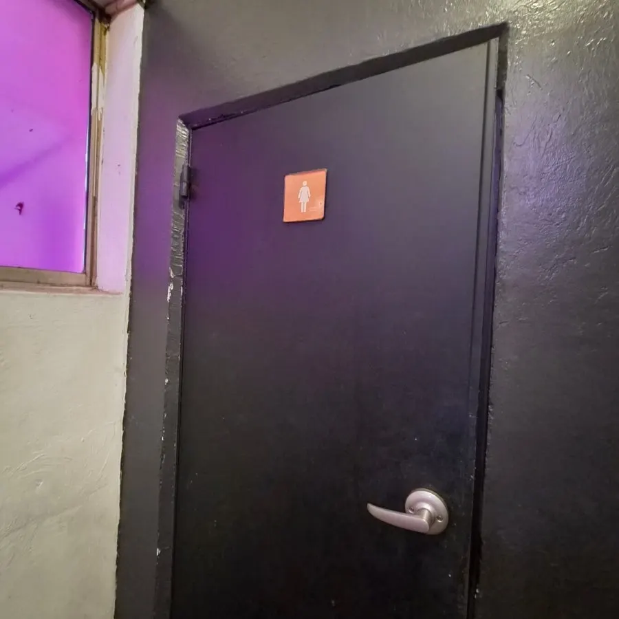 Restroom corridor connecting to the outside at the back of the venue