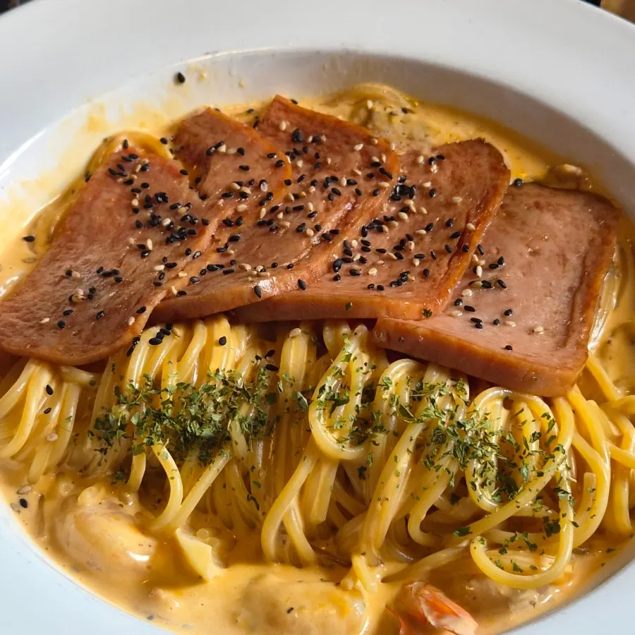 Fire chicken cream pasta topped with Spam