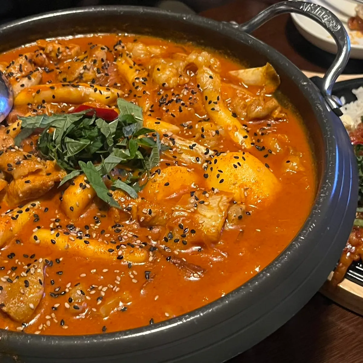 Fire-grilled buldak-bal served with bean sprouts and rice