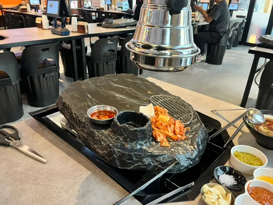 Volcano-shaped grill plate set up on the table