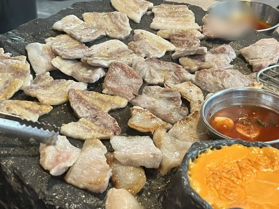 A plate of perfectly grilled meat ready to eat