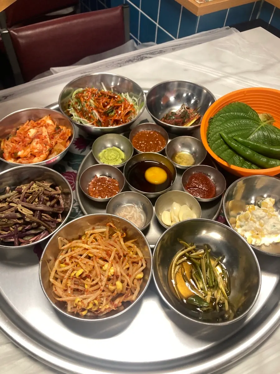 Assorted side dishes served with the pork belly