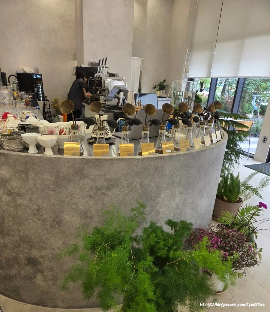 Bean-sniffing corner with specialty beans like Kopi Luwak and Geisha
