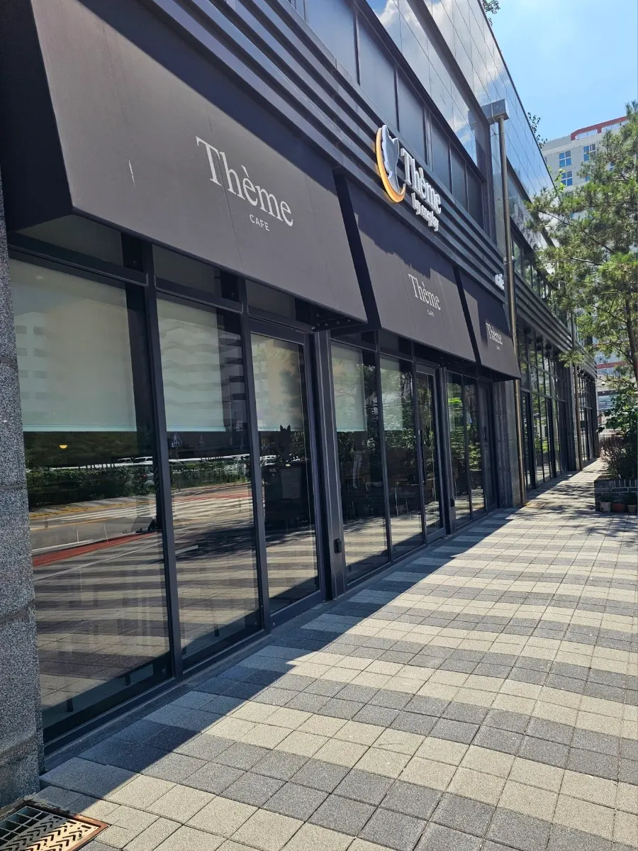 Café entrance with business hours signage