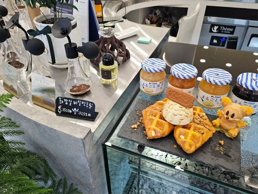 Dessert display case with croffles and cakes