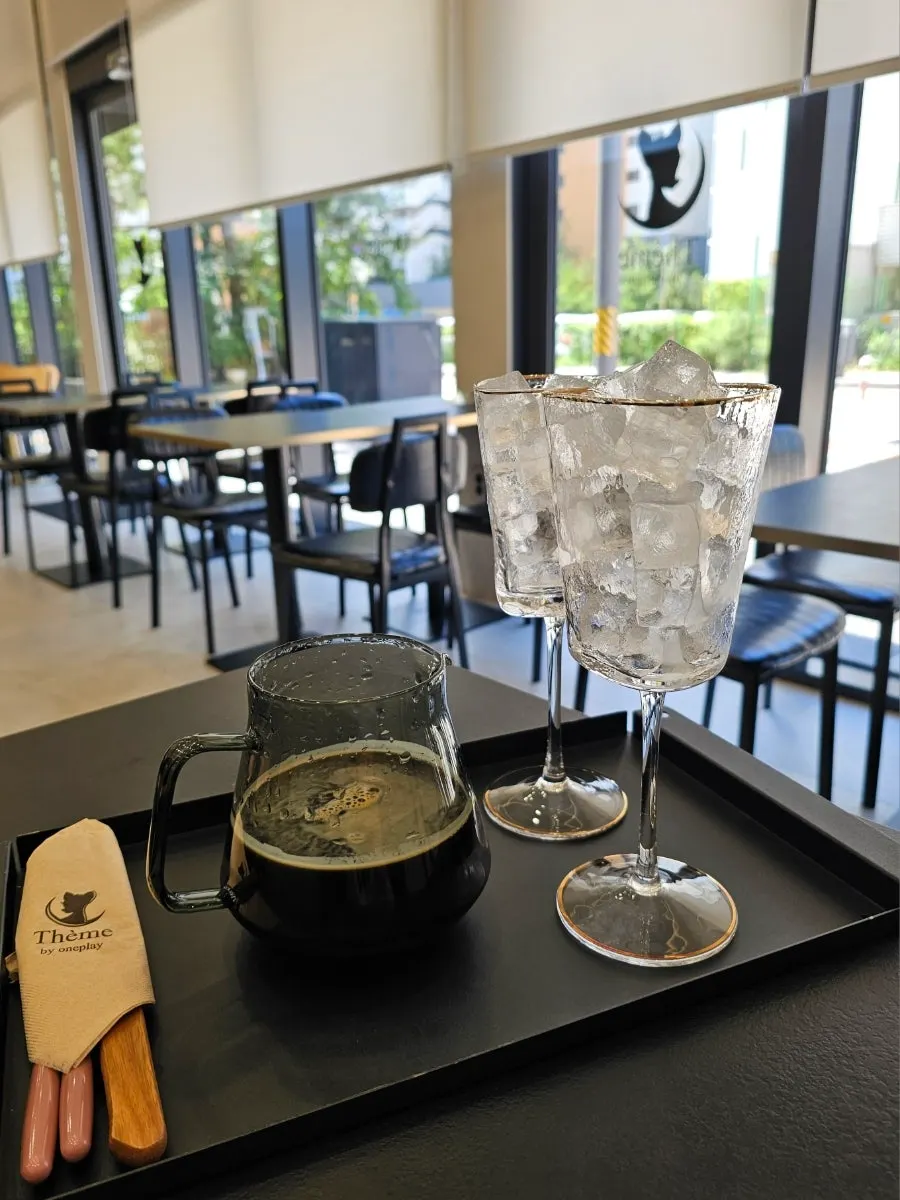 Café interior with picture windows and tables