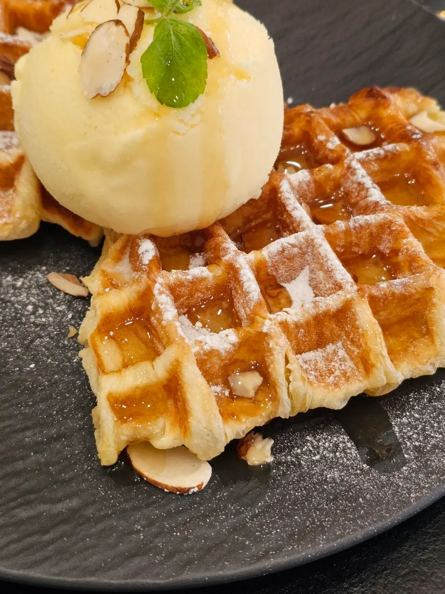 Ice cream croffle topped with vanilla ice cream