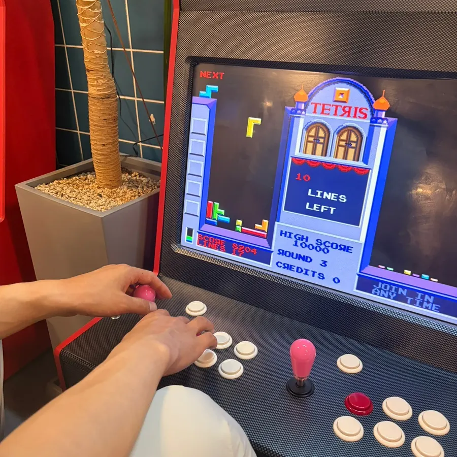 Arcade machine enjoyed during the wait