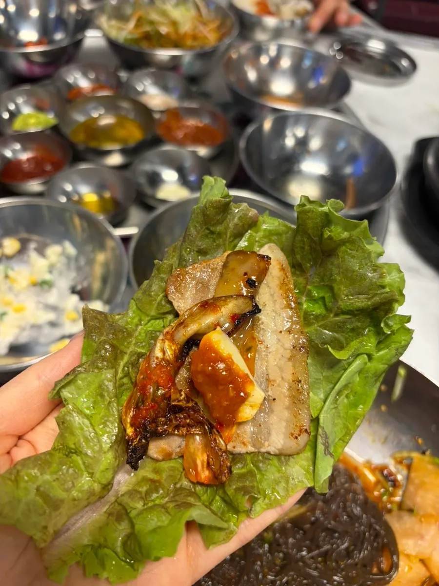 Bean sprouts, bracken fern, and kimchi accompaniments