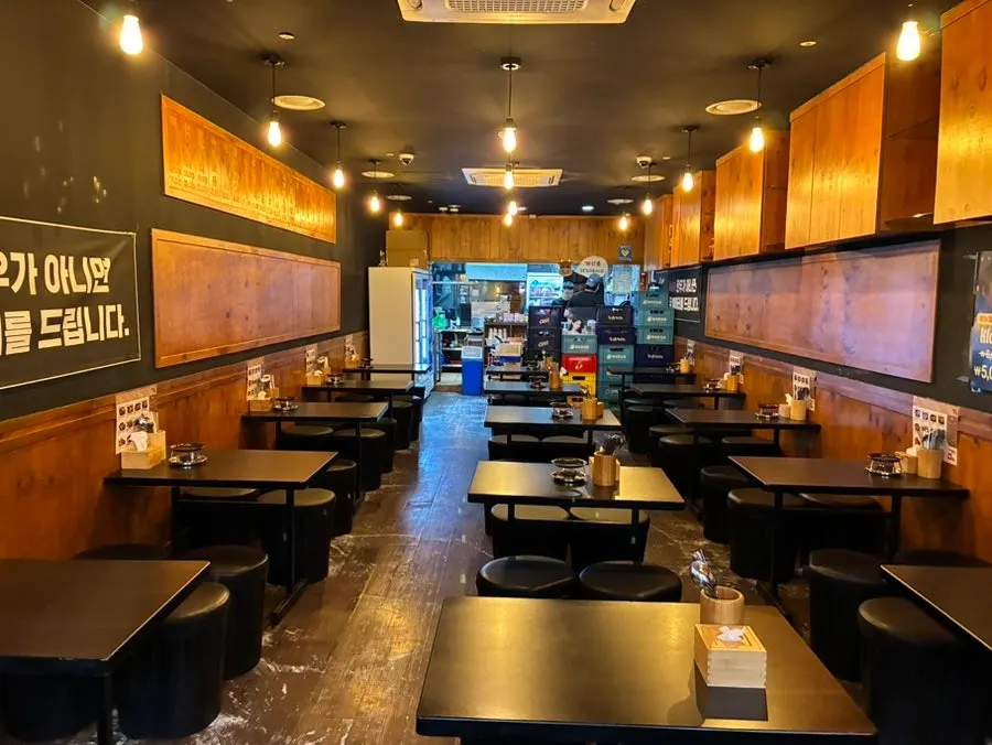 Interior of Yukhoe Dokjon with generously spaced tables