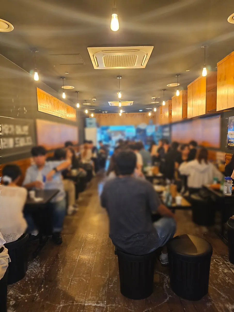 Interior of Yukhoe Dokjon Suwon Station Branch full of customers