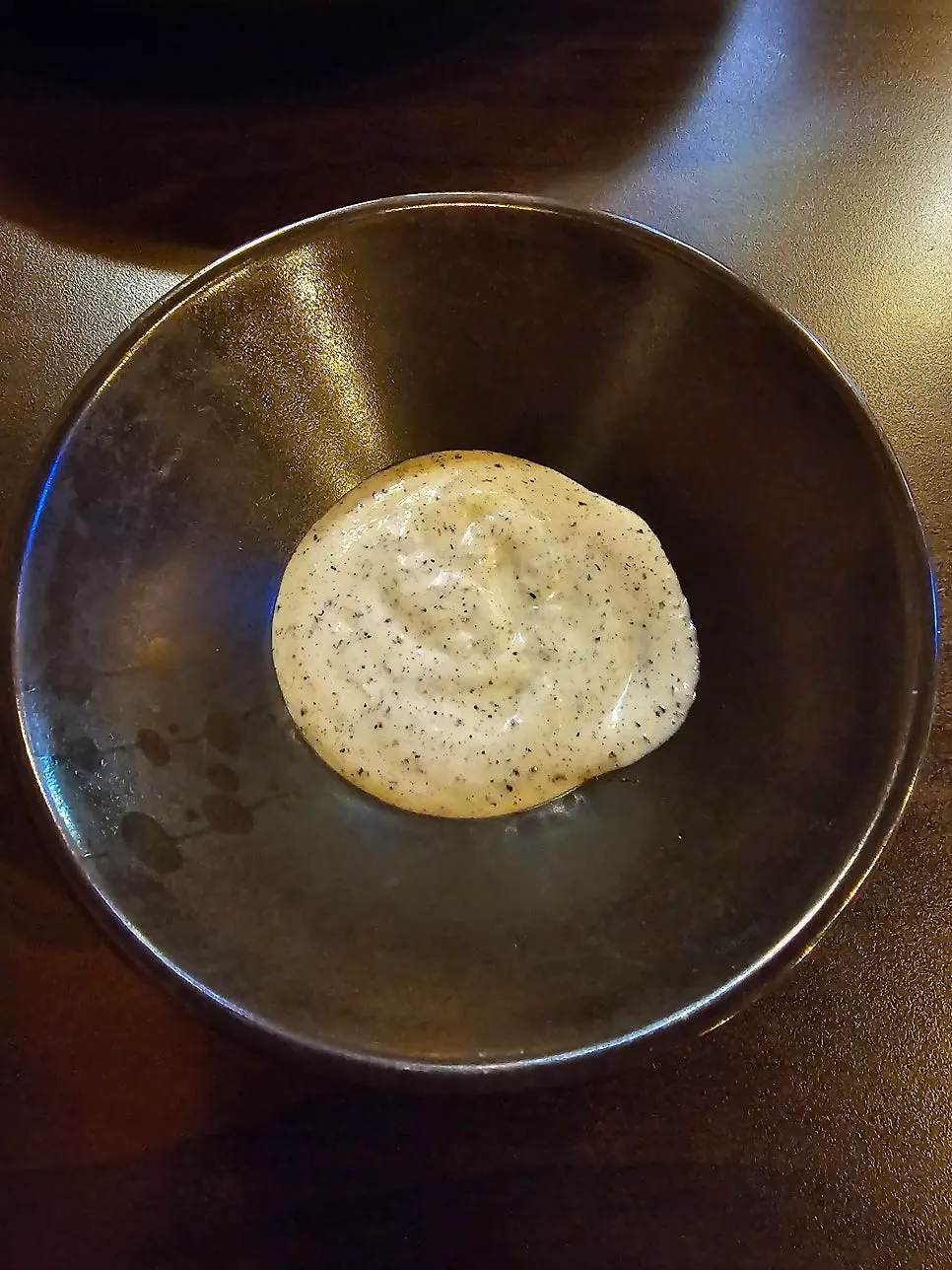 Black sesame sauce served alongside the dish