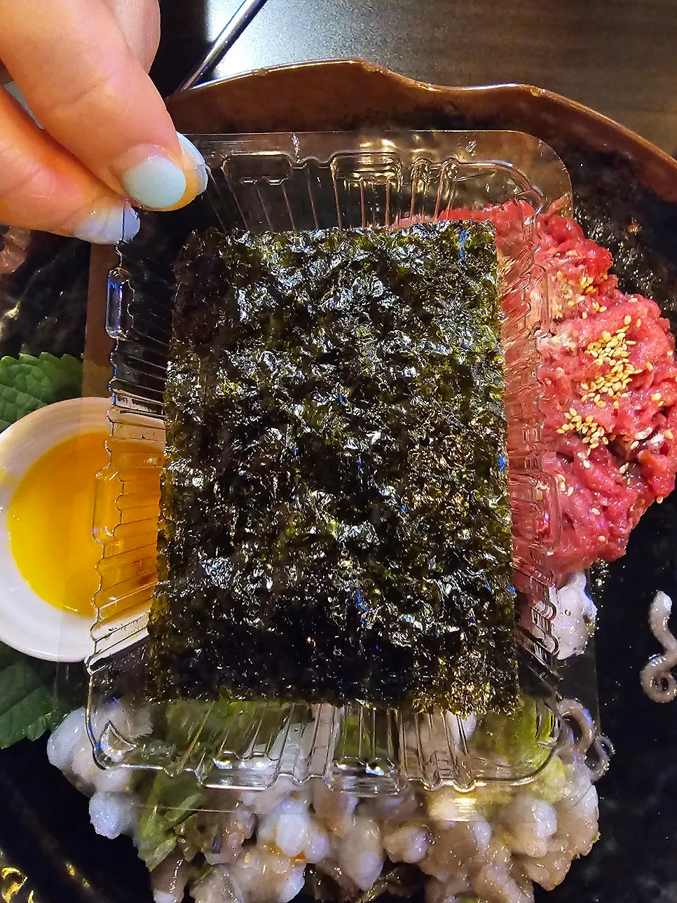 Extra seaweed served with the live octopus hanwoo yukhoe