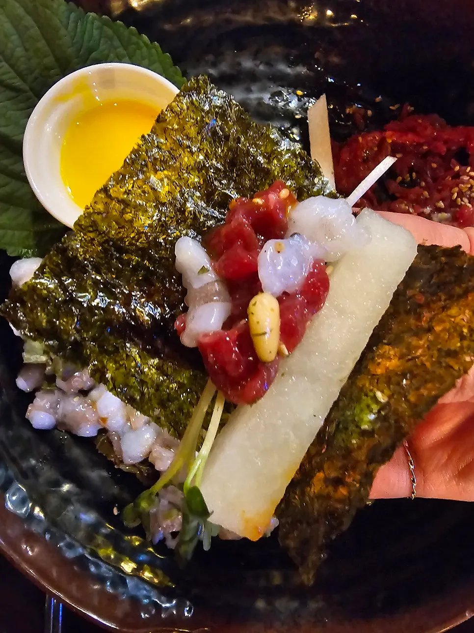 Yukhoe and octopus wrapped together in seaweed