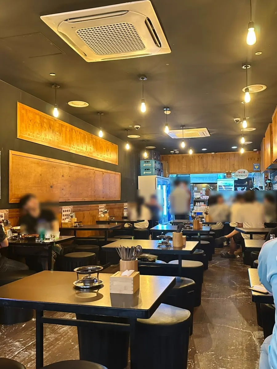 Interior of Yukhoe Dokjon with spacious seating and bright lighting