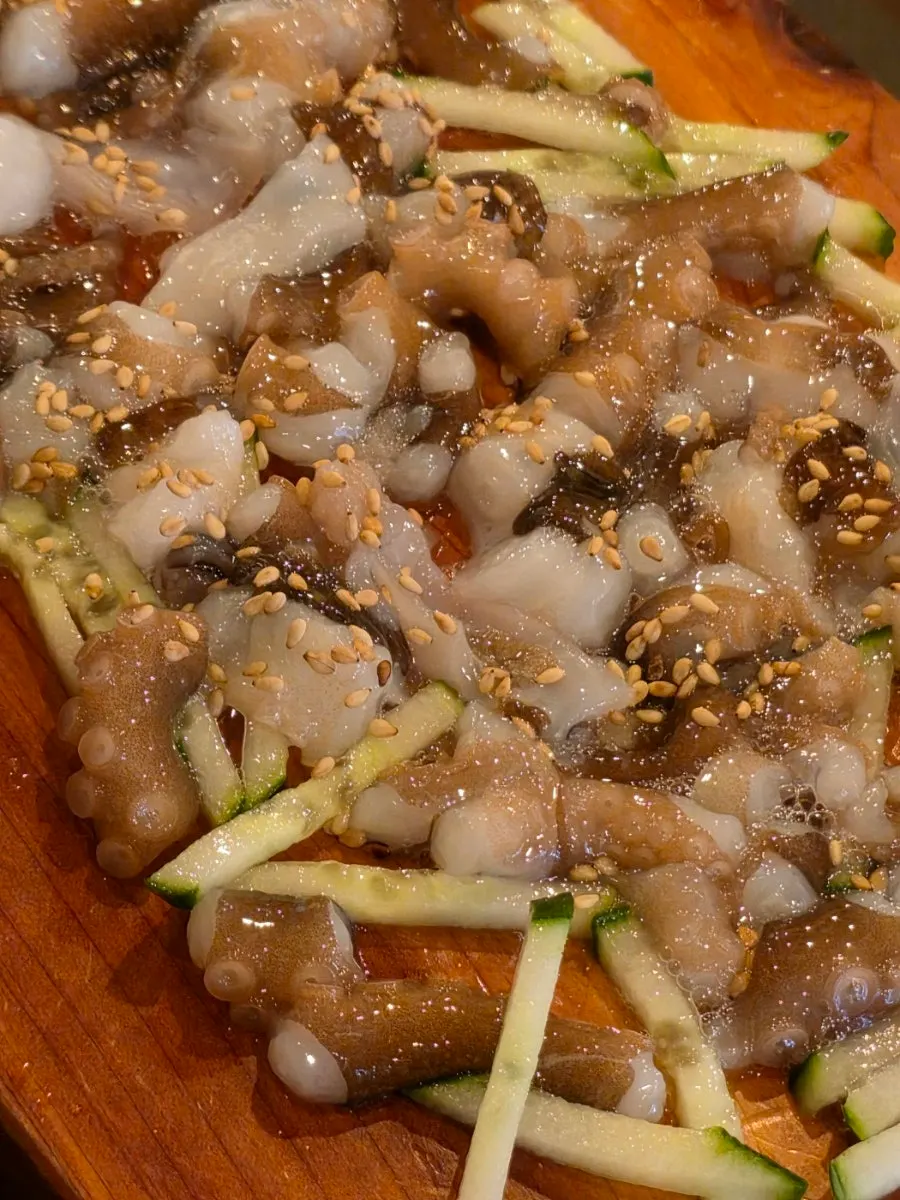 Live octopus served with beef tartare and sashimi