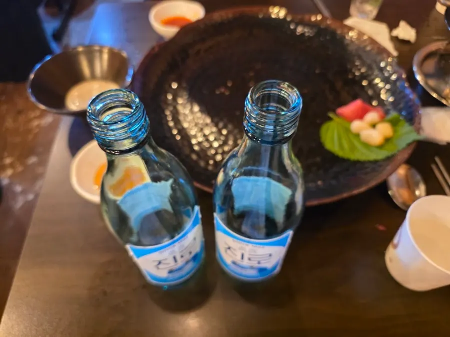 Empty tartare plate and soju bottle