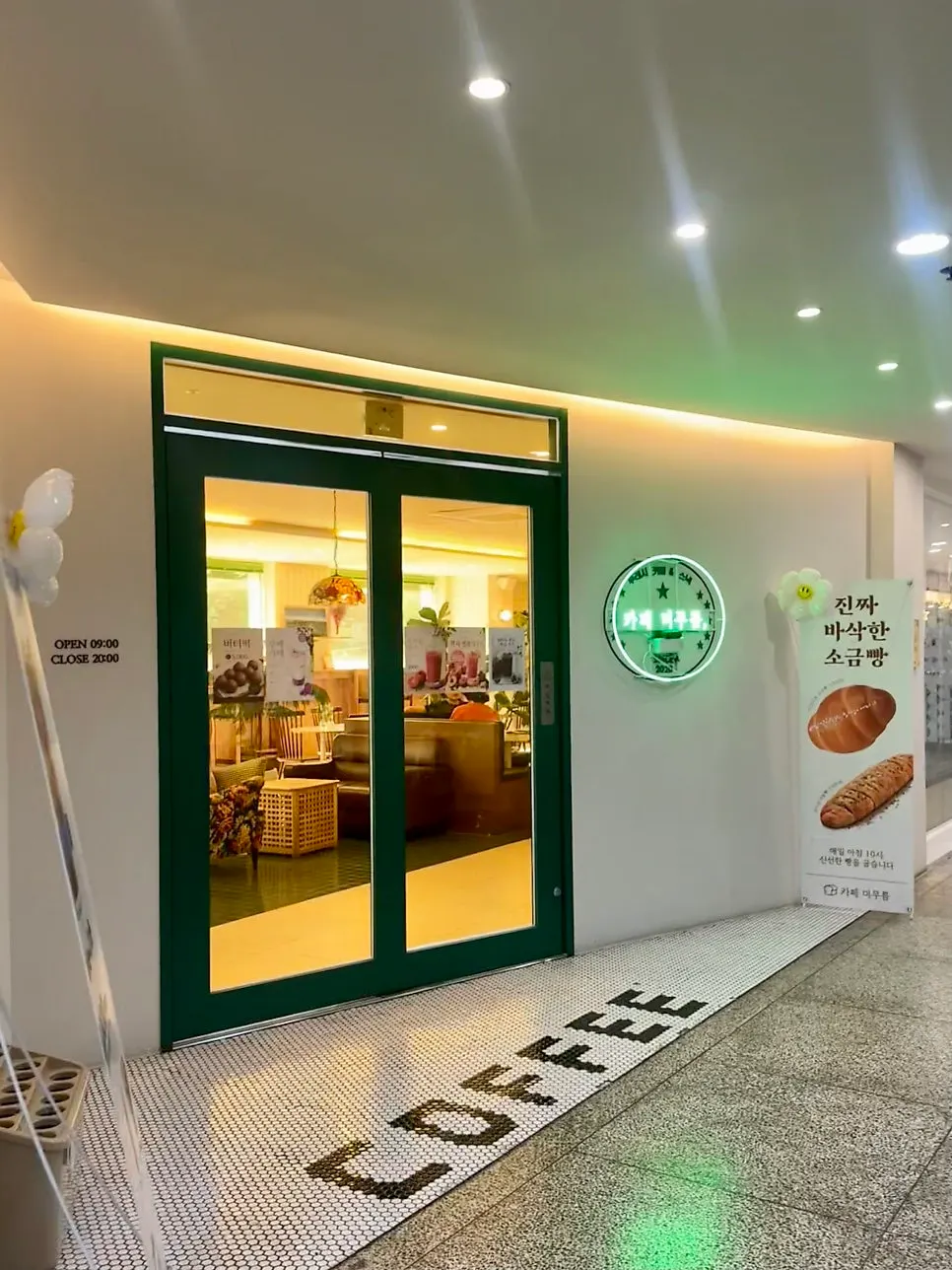 Café entrance with white and green accents
