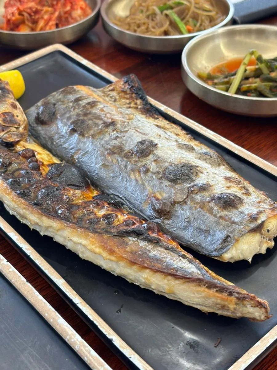 A piece of mackerel showing moist flesh inside