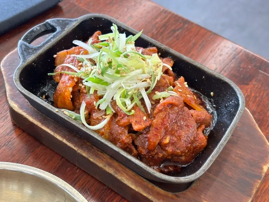 Table setting with japchae and mul kimchi