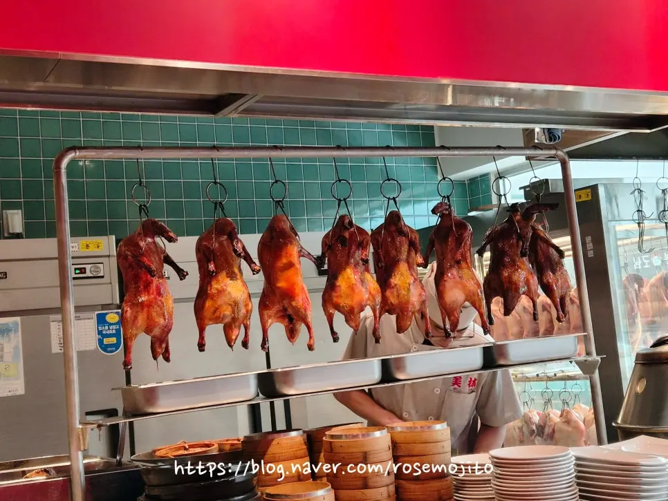 Peking duck hanging in front of the kitchen