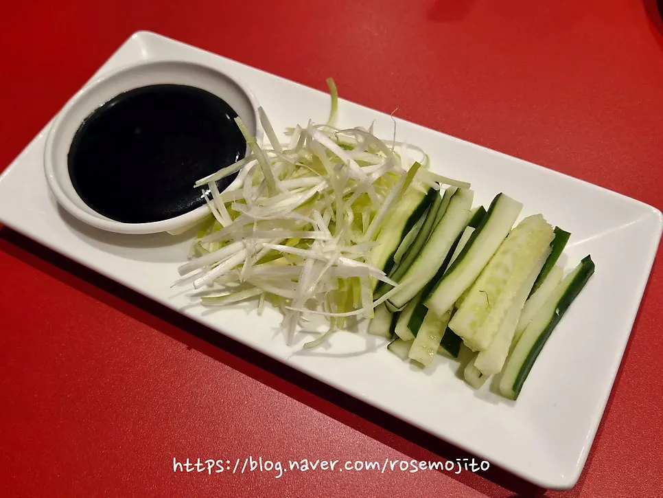 Half Peking duck with wheat pancakes, scallion strips, and cucumber