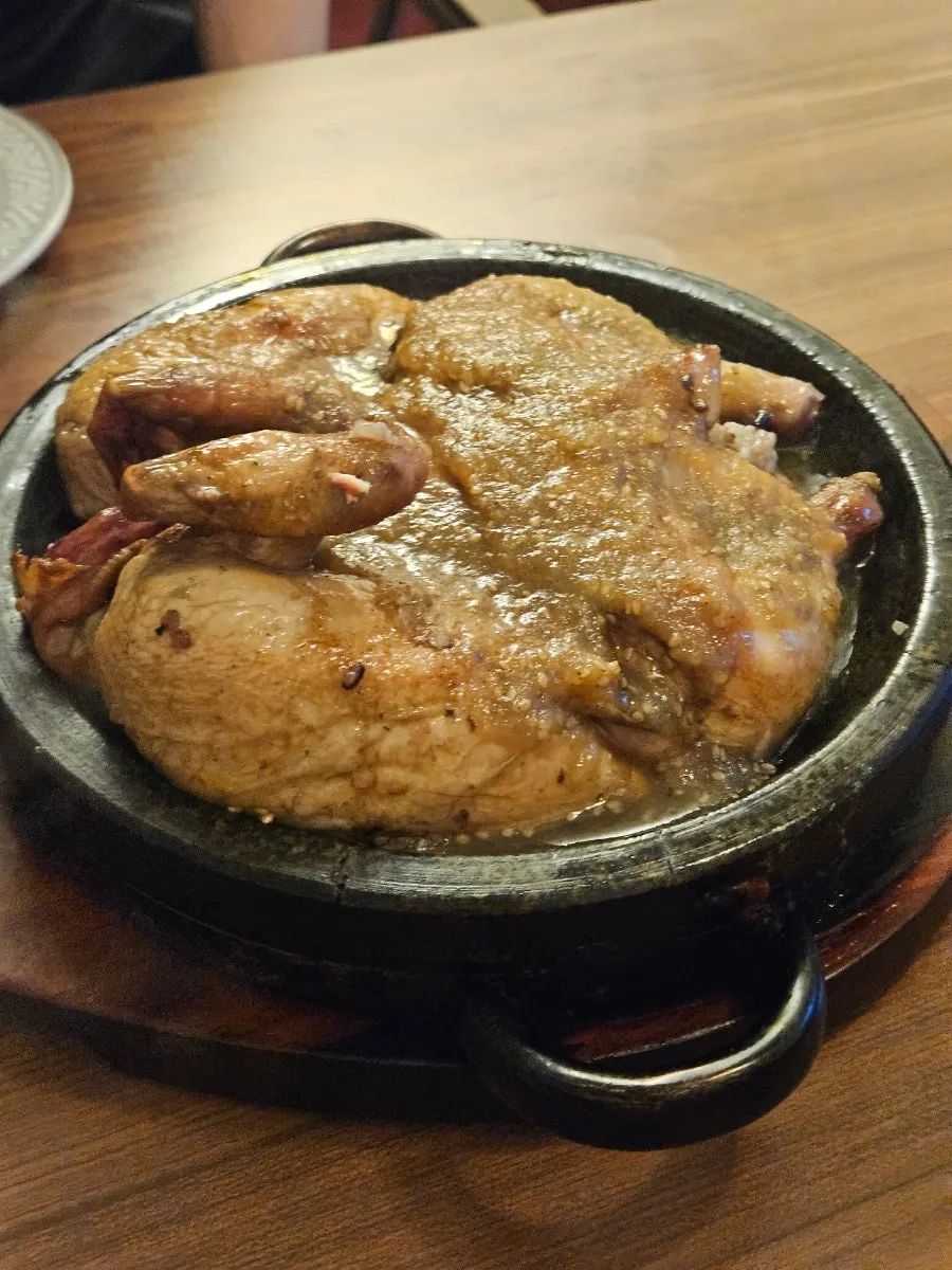 Hot-plate scorched rice beneath the whole chicken