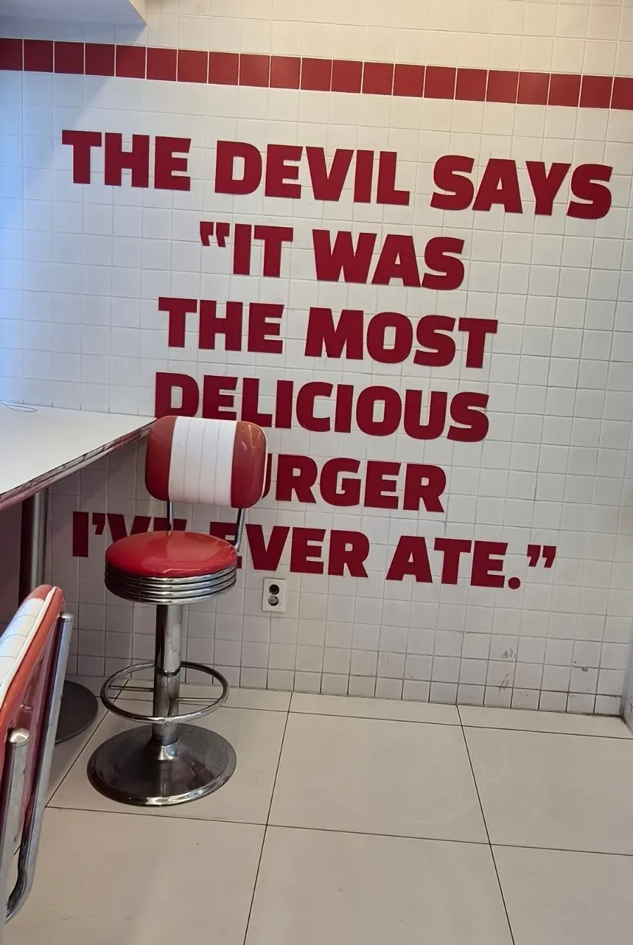 Wall text about the devil at 666 Burger Main Branch