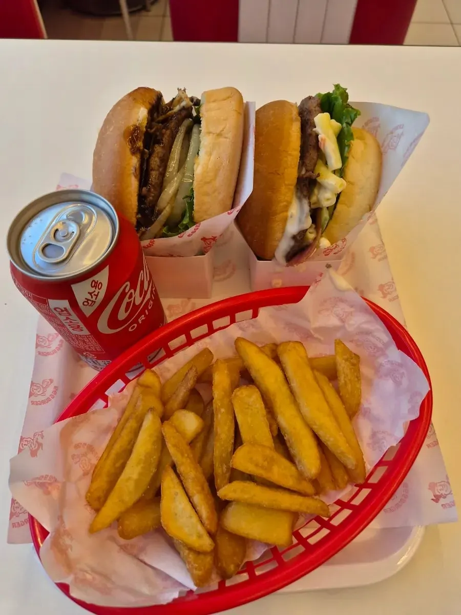 Set with burger, fries, and Coke served on the table