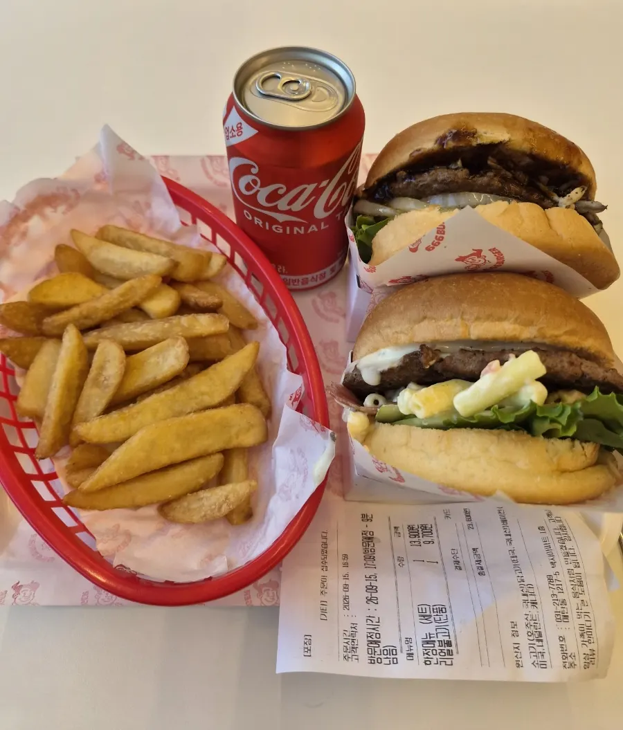 Burger showing thick patty and sauteed onions