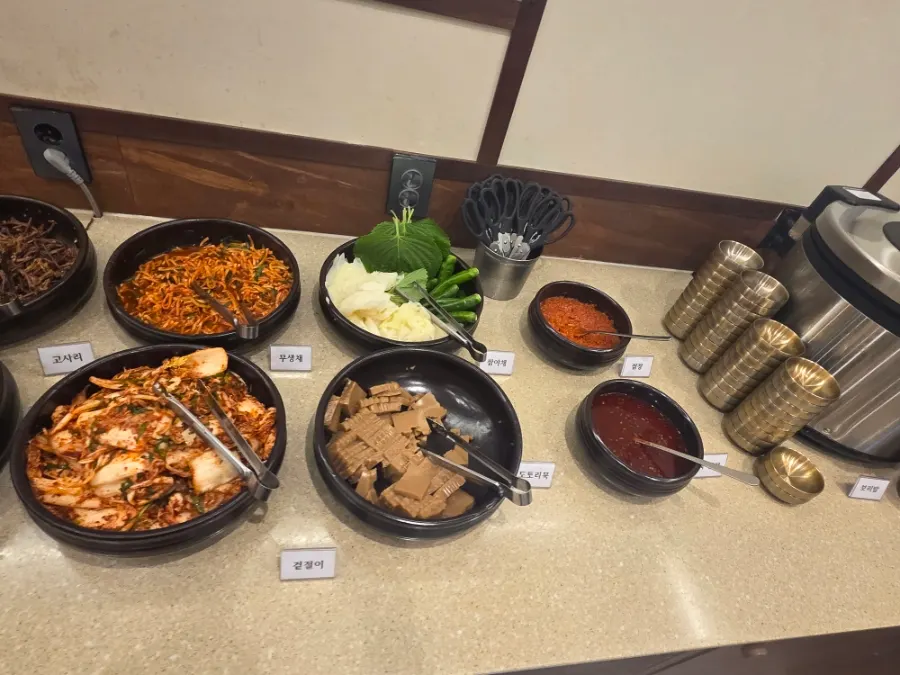 Table setting with namul side dishes at Boriook Main Branch
