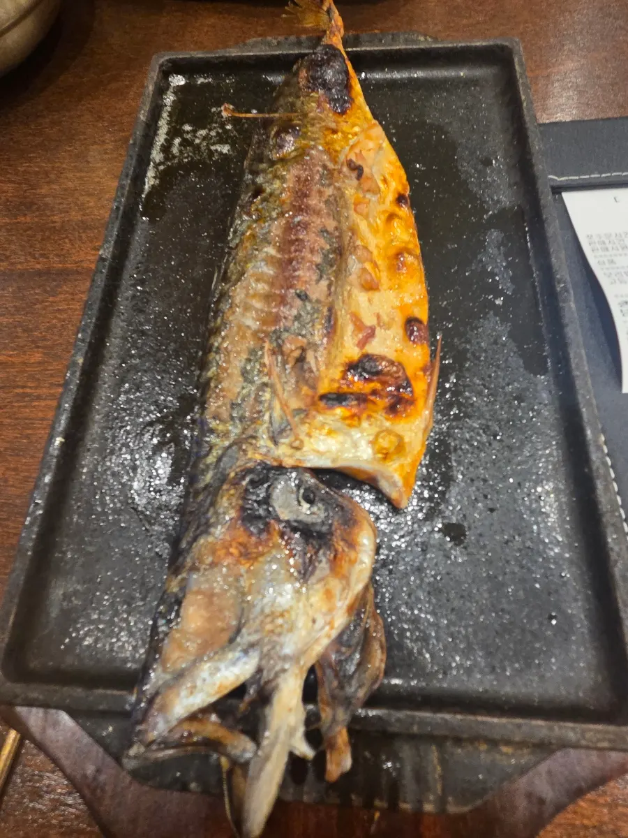 Half mackerel grilled golden brown, part of the set