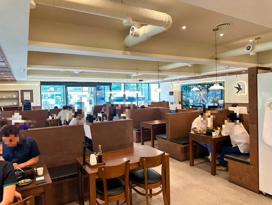 The dining hall at Boriook Main Branch with guests