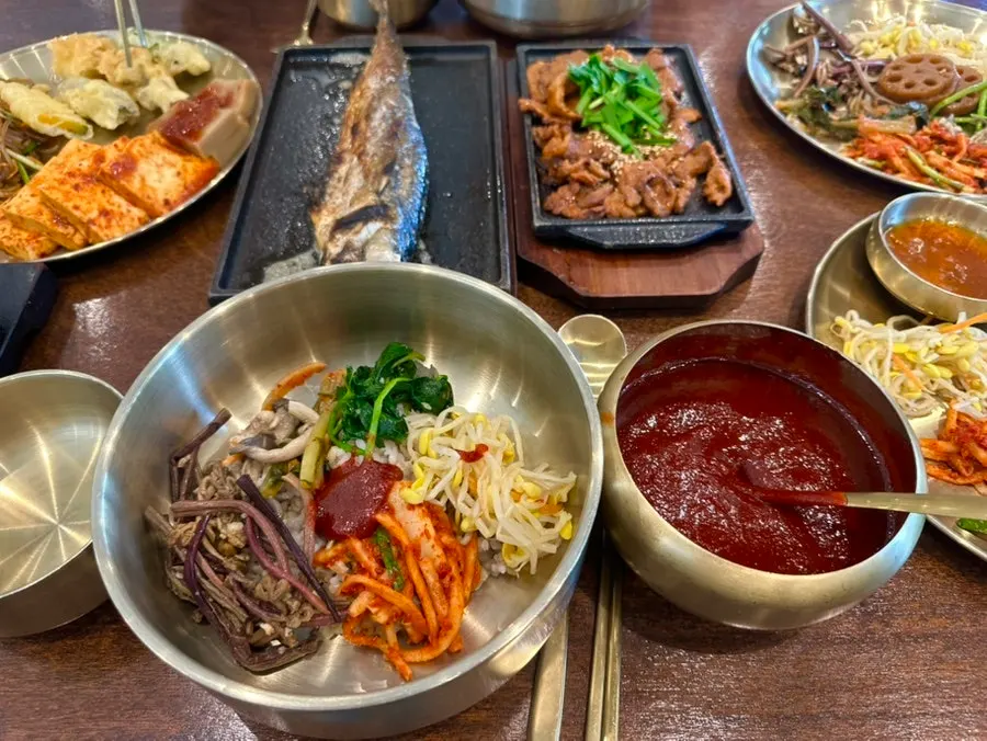 A bowl of barley rice with namul and gochujang added
