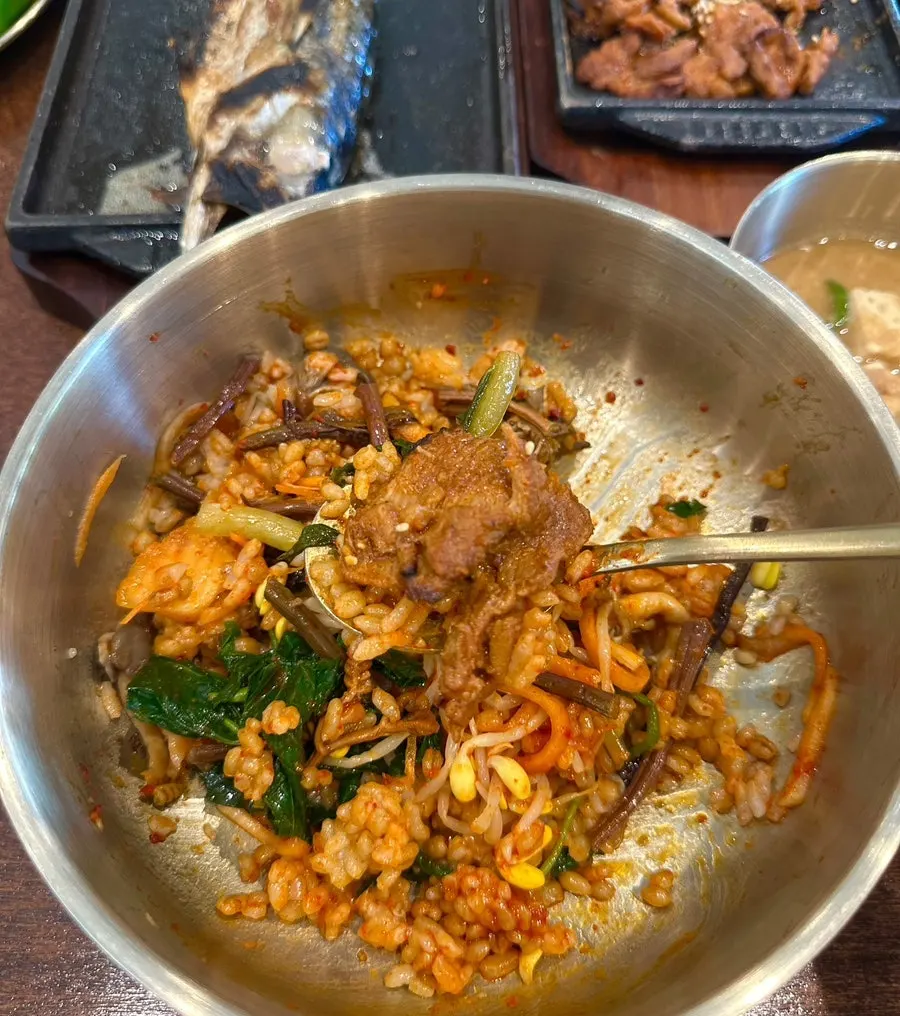 Gochujang pork on top of mixed barley rice
