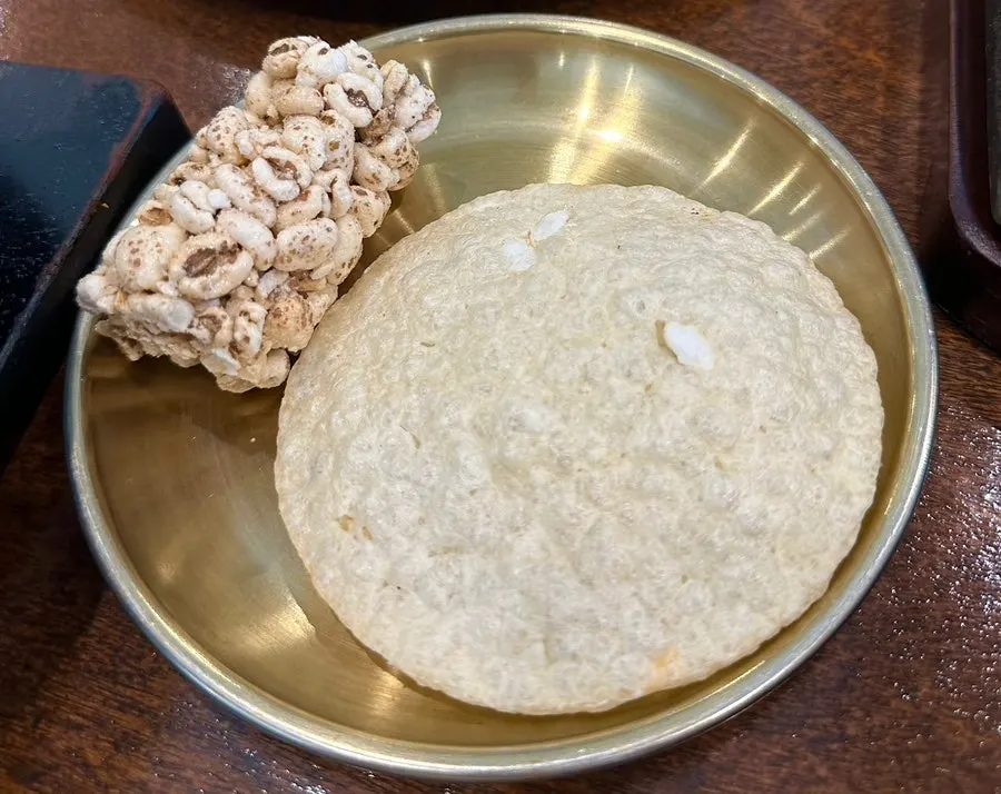 Puffed rice snack and plum tea for dessert