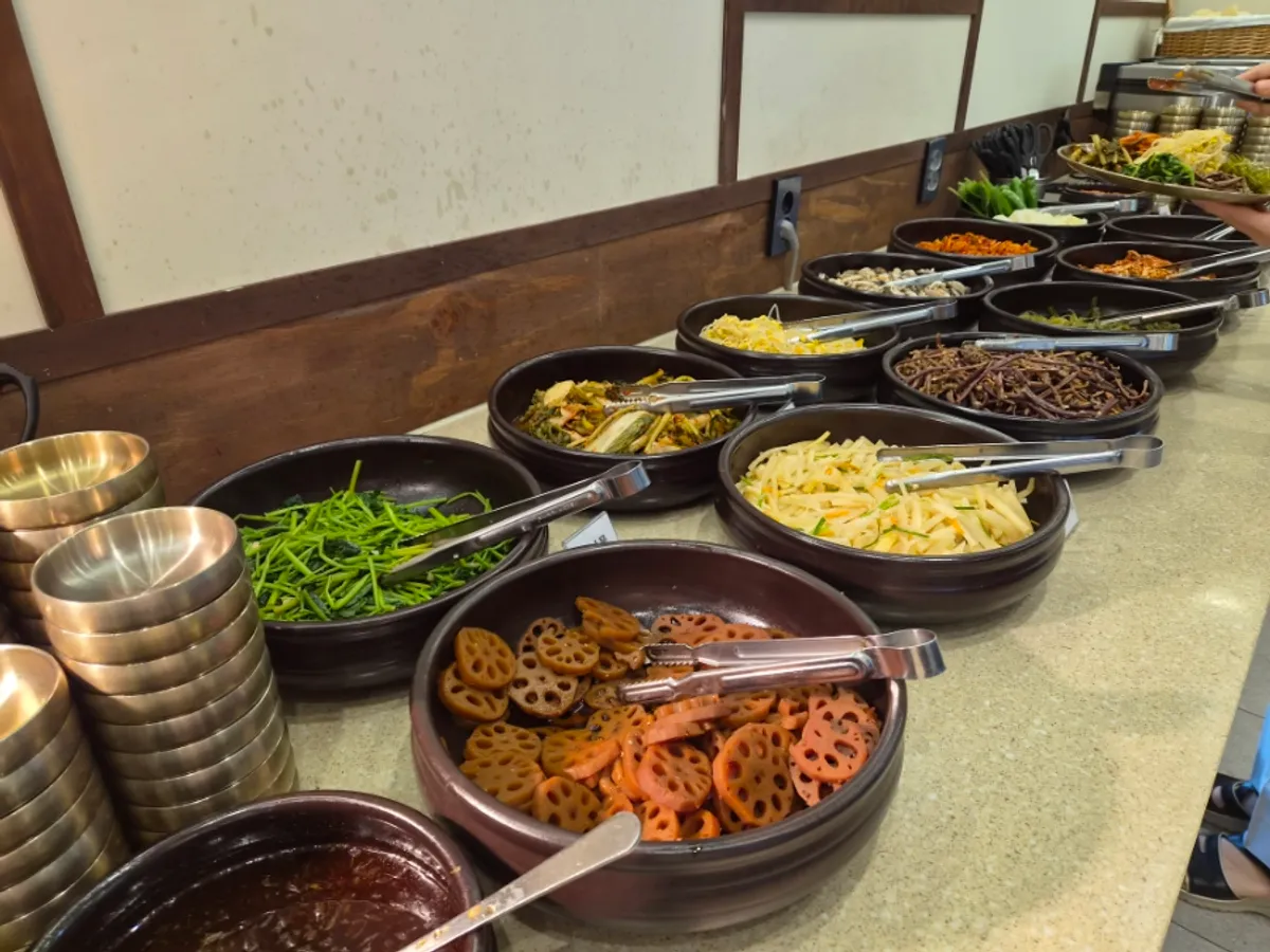 Self-serve bar at Boriook Main Branch with namul and japchae